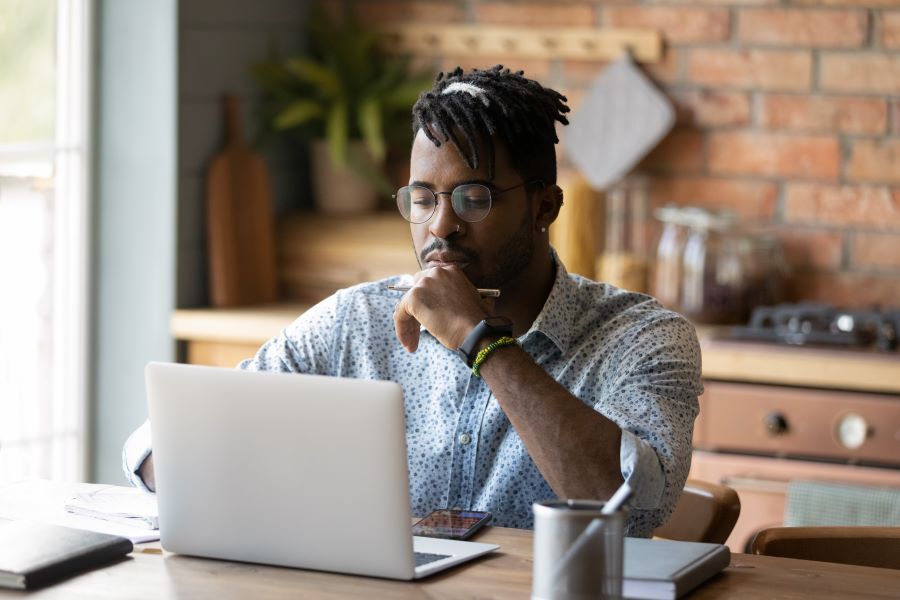 Nigerian trader analyzing information